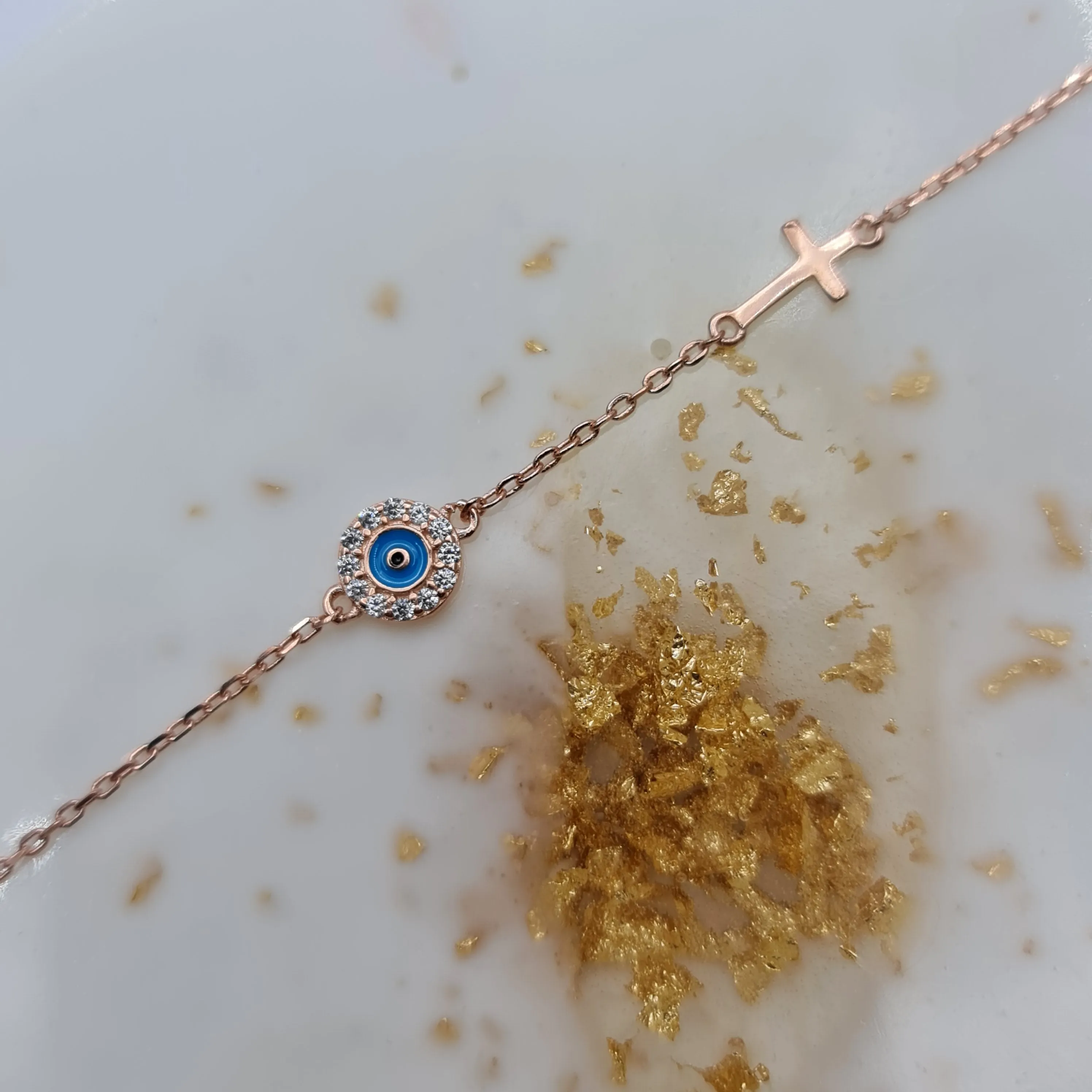 Dion blue evil eye and cross cz bracelet in rosegold