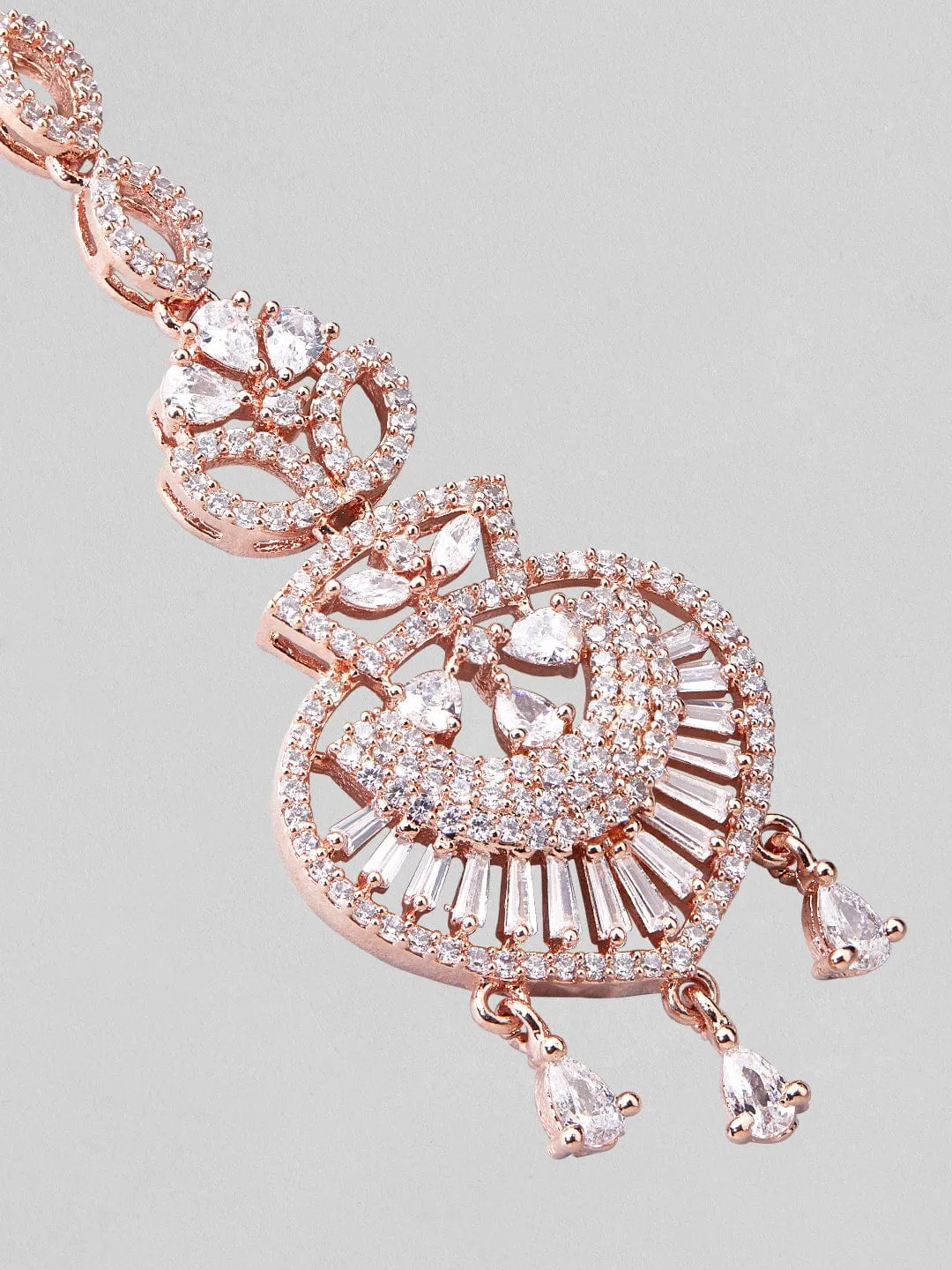 Rubans rose gold plated mangtikka with american diamonds.