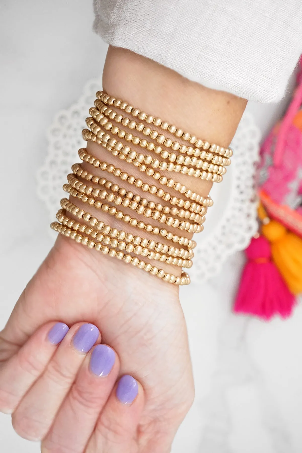 Small Worn Gold tone and Glass beads bracelet stack of 4 bracelets